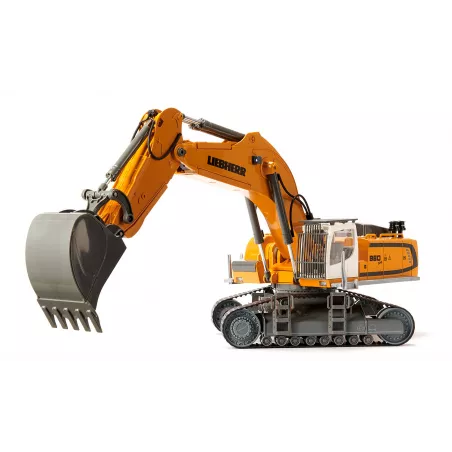 Excavadora teledirigida Liebherr R980 RC a escala 1:32 con brazo móvil y chasis de orugas.