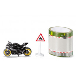 Modelo a escala Ducati Panigale 1299 en negro mate con detalles dorados y cinta de pista.