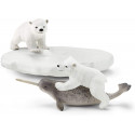 Tobogán de osos polares Schleich con figuras de oseznos y narval de juguete sobre témpano de hielo.