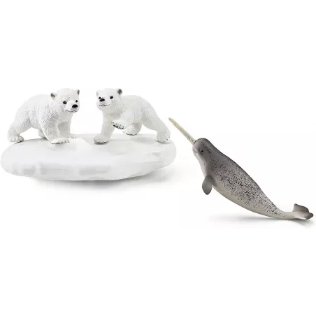 Tobogán de osos polares Schleich con figuras de oseznos y narval de juguete sobre témpano de hielo.