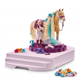 Estación de aseo de caballos de juguete Schleich con cepillos, secador y accesorios decorativos para equinos.